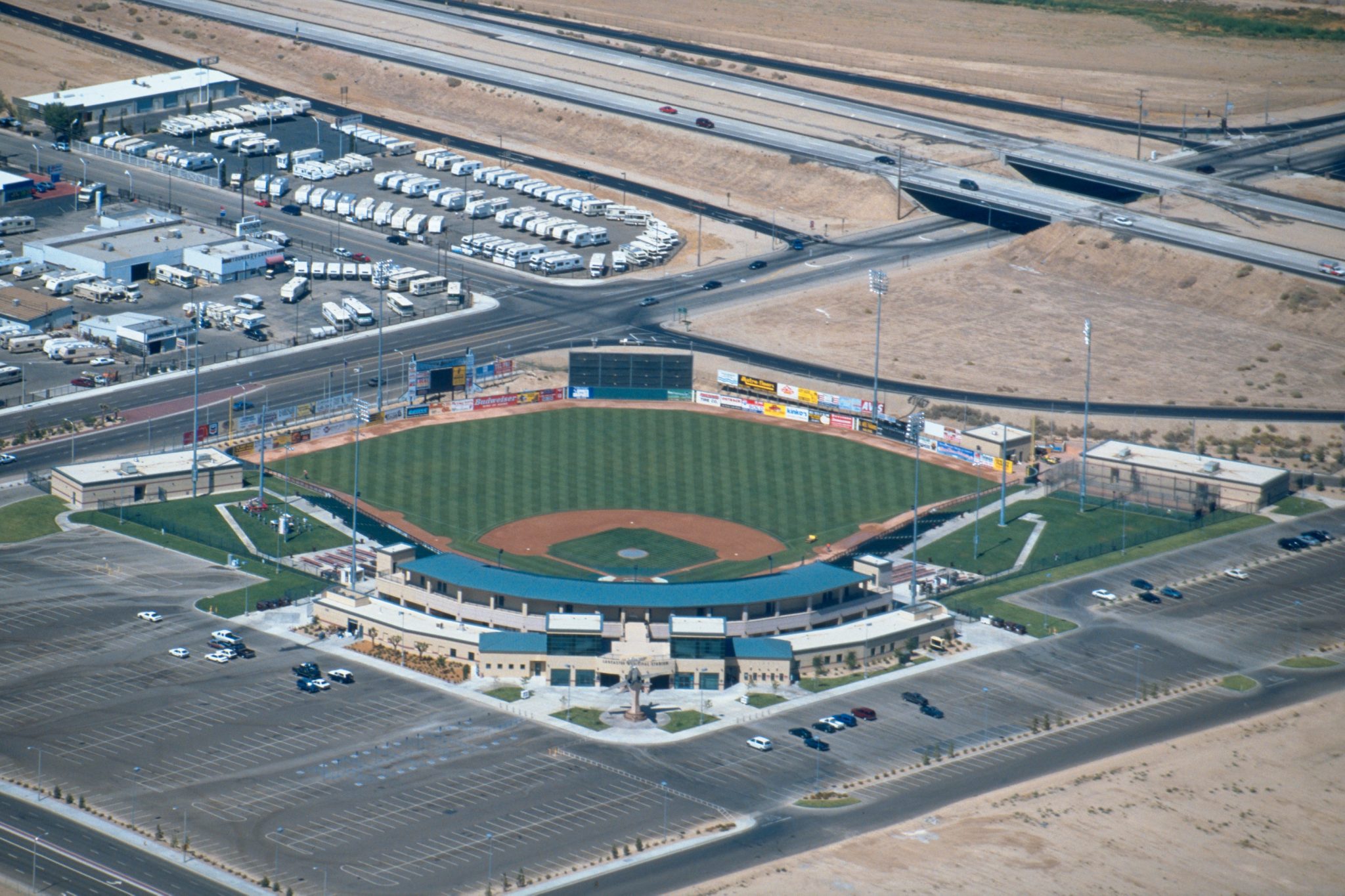 The stadium is adjacent to a retail development & near an Air Force base.