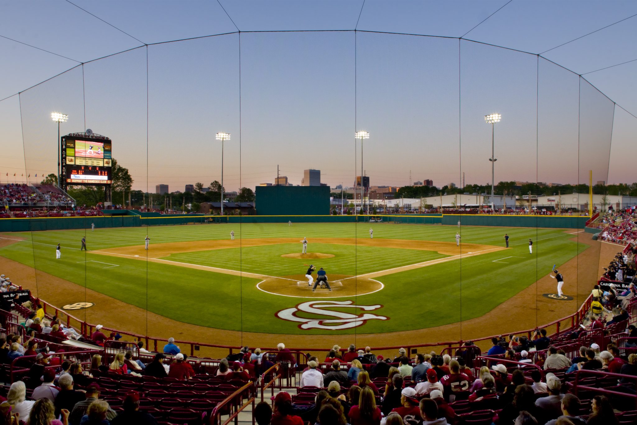 The University of South Carolina baseball stadium, home of the Gamecocks, features a city skyline view beyond center field.